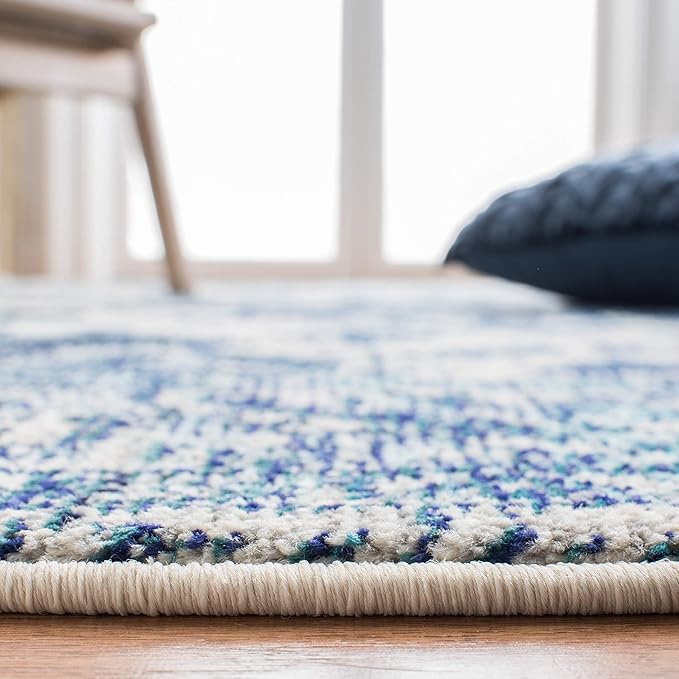 SAFAVIEH Monaco Collection Area Rug - 9' x 12', Ivory & Blue, Boho Chic Medallion Distressed Design, Non-Shedding & Easy Care, Ideal for High Traffic Areas in Living Room, Bedroom (MNC243A)