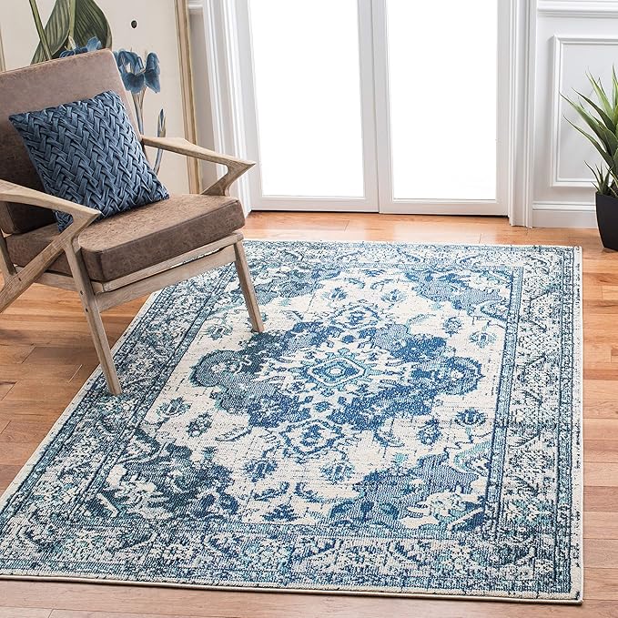SAFAVIEH Monaco Collection Area Rug - 6'7" x 9'2", Ivory & Blue, Boho Chic Medallion Distressed Design, Non-Shedding & Easy Care, Ideal for High Traffic Areas in Living Room, Bedroom (MNC243A)